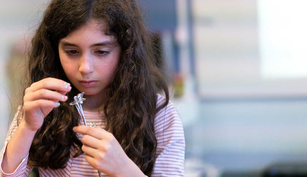 Young child working on science project