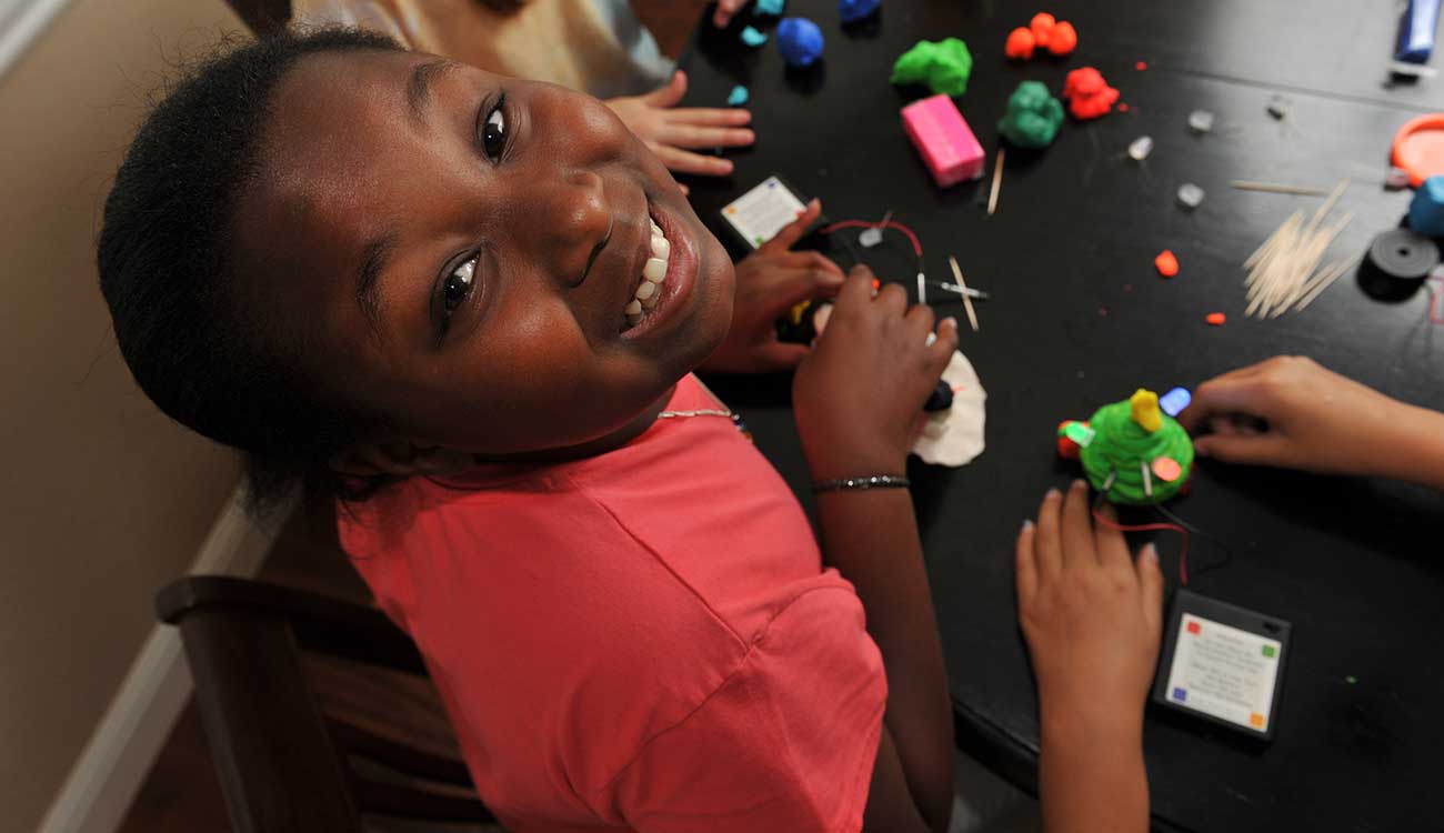 Young child conducting science experiment